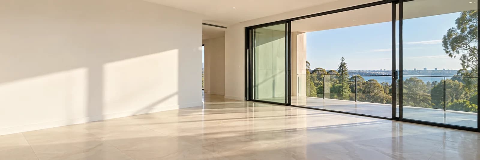 Bright vacant apartment with timber floors and an open-plan kitchen